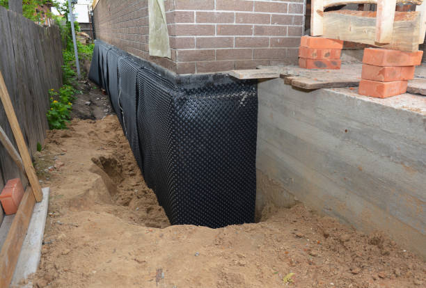 Happy homeowners after waterproofing job in Burrton